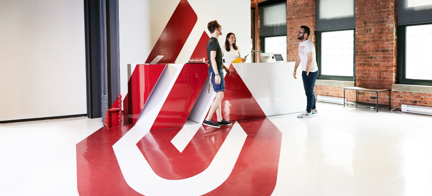 Colleagues standing near Lightspeed HQ reception