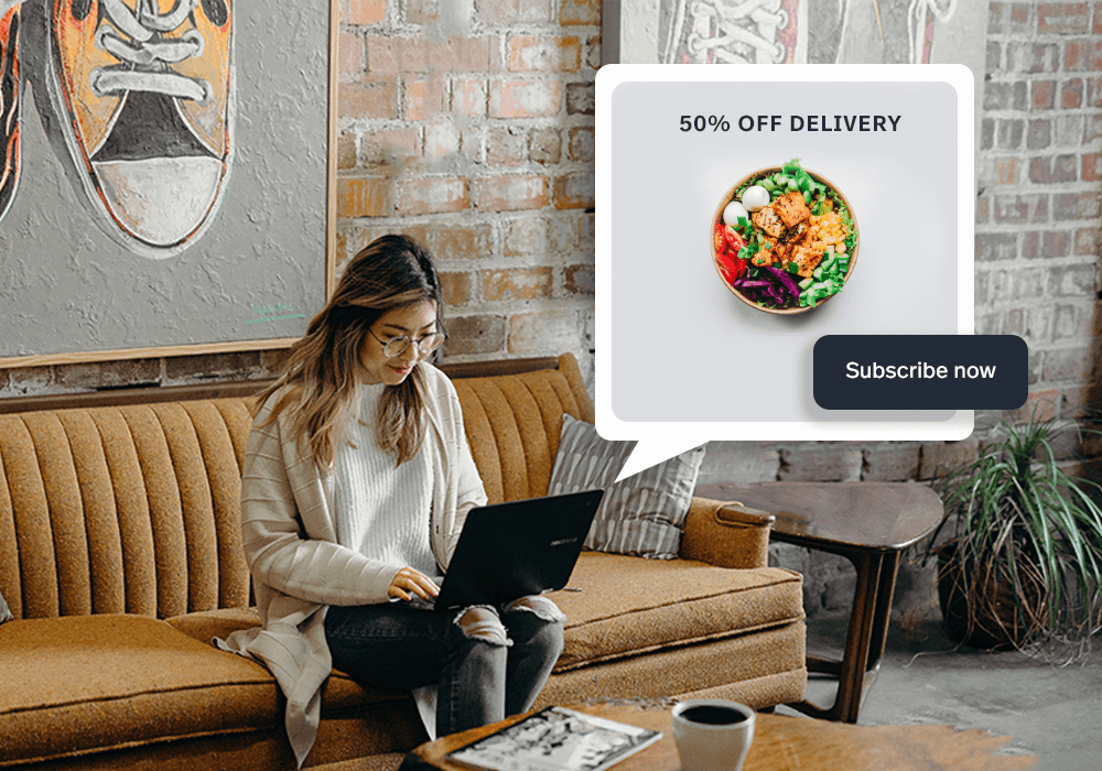 Woman sitting on couch browsing options for food delivery