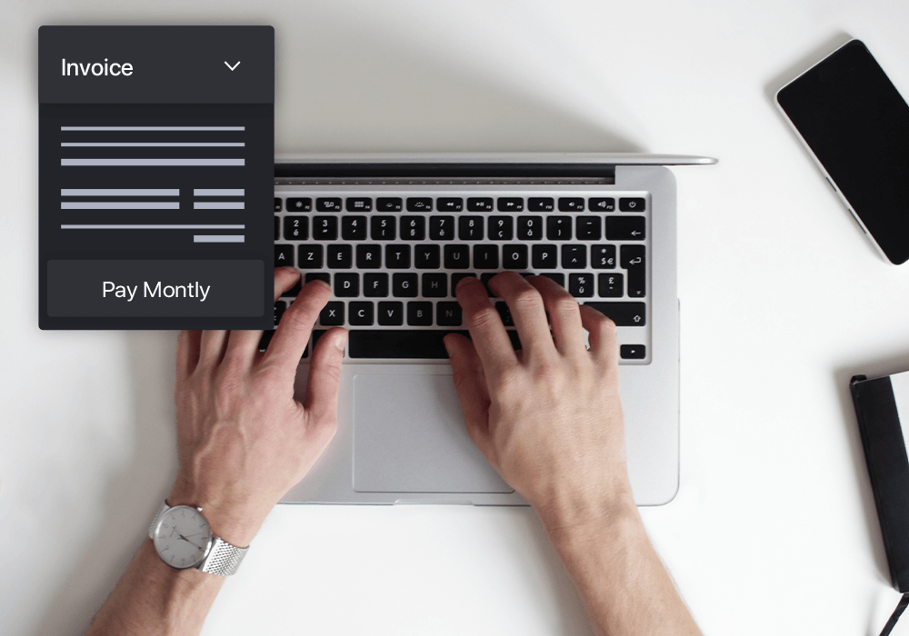 hands accessing invoice on laptop
