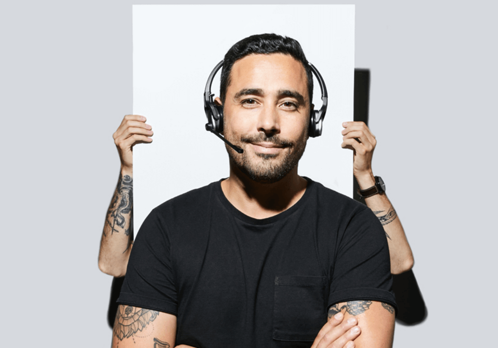 Support worker in headphones smiling