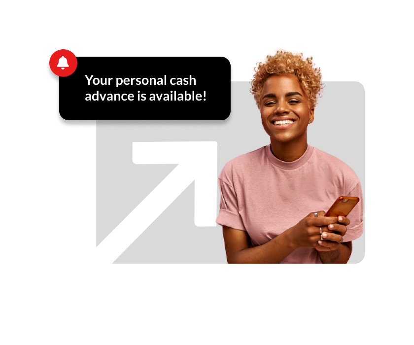 A woman smiling at the camera while holding a phone