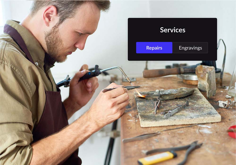 Repairman fixing jewellery on a worktop