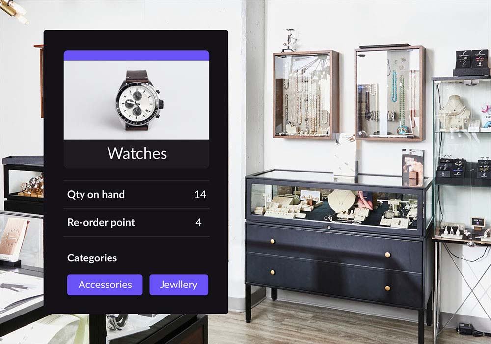 Watch shown on Lightspeed Retail's inventory management interface. Quantity on hand, re-order point and product categories are shown below it. Jewellery shop layout in background