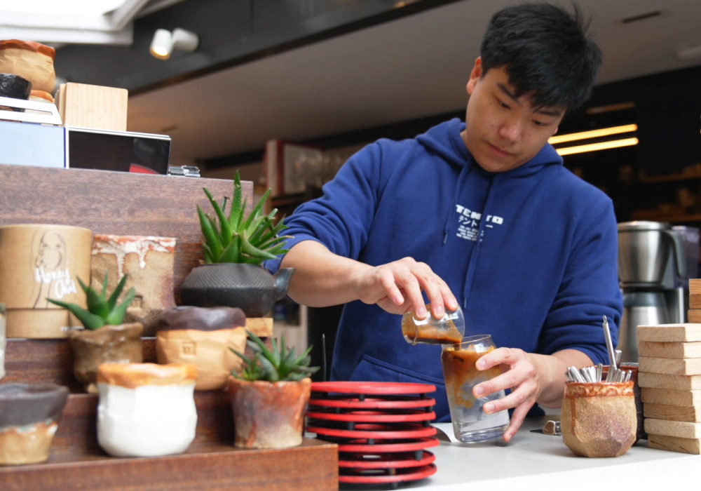 Barista making iced coffee