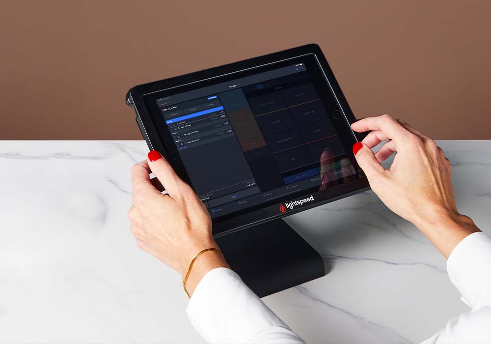 hands using Lightspeed on an iPad