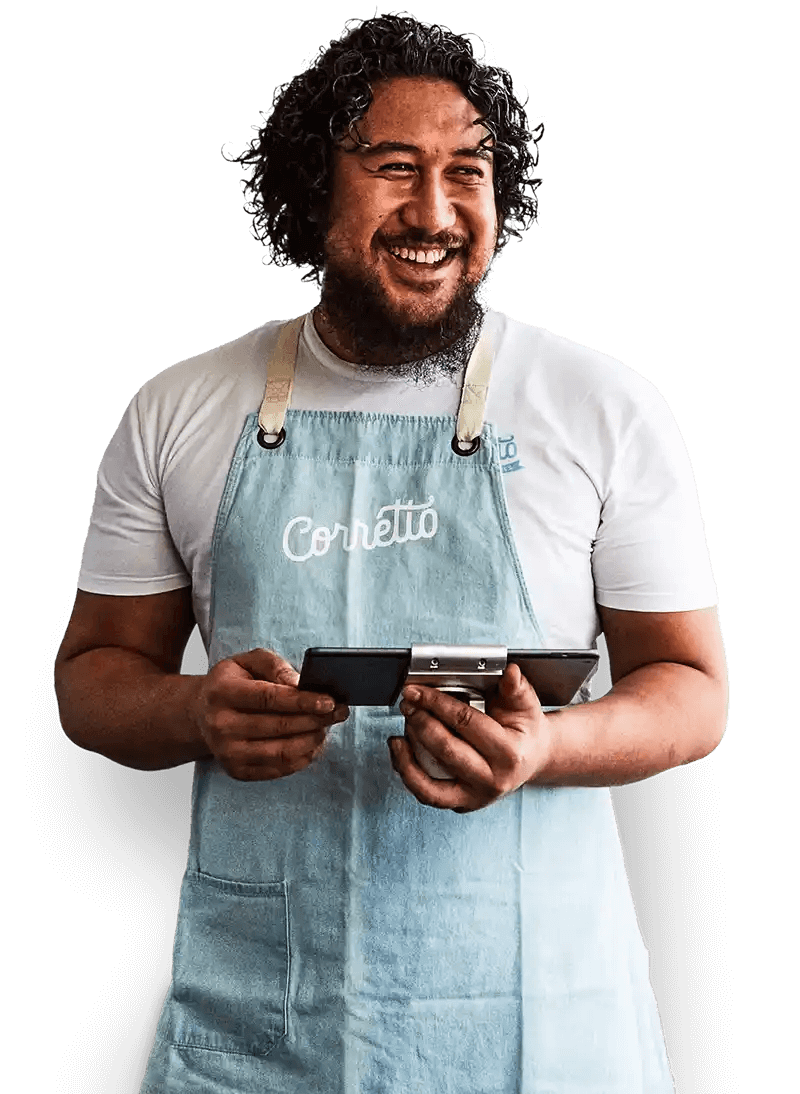 Image of a waiter with a blue apron on holding an iPad