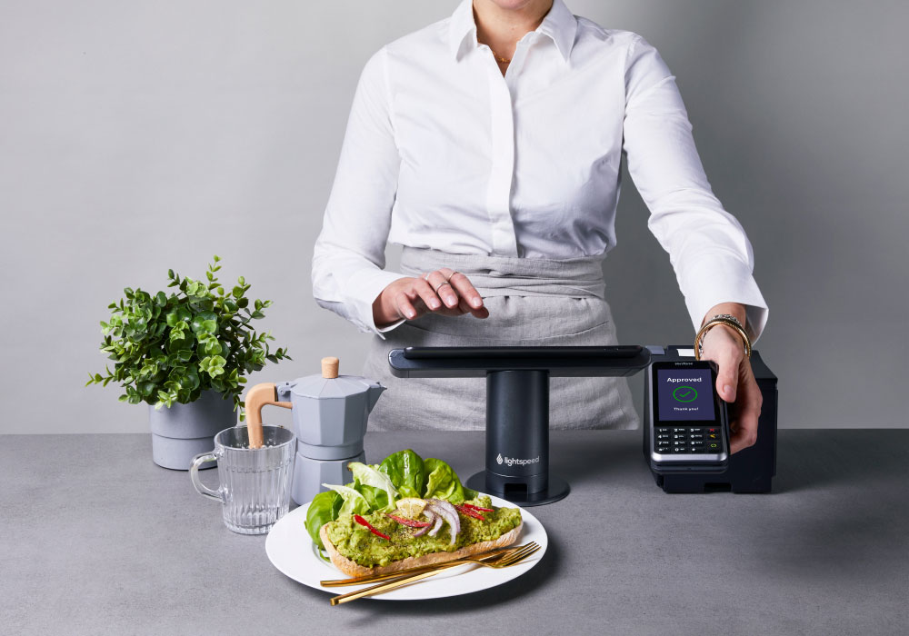 Hospitality staff taking payments on Lightspeed