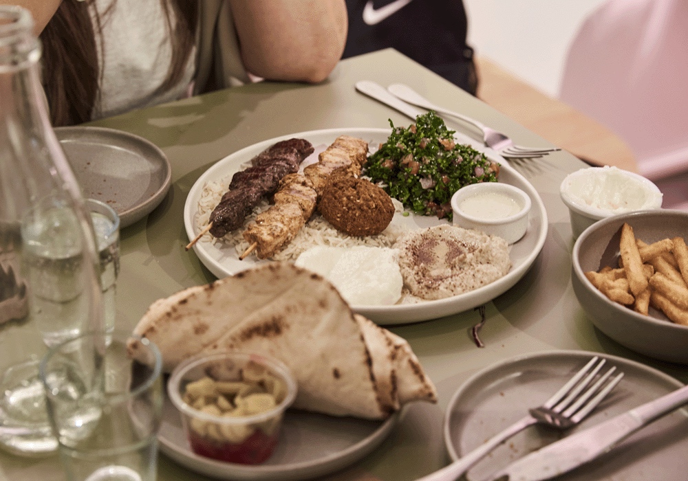 Dining at Eat Lebanese skewers, falafel, tabouli, pita bread