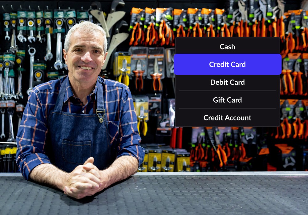 A man looks at the camera in front of stock in his construction store with a floating module showing payment methods in Lightspeed's POS system for constructions stores.