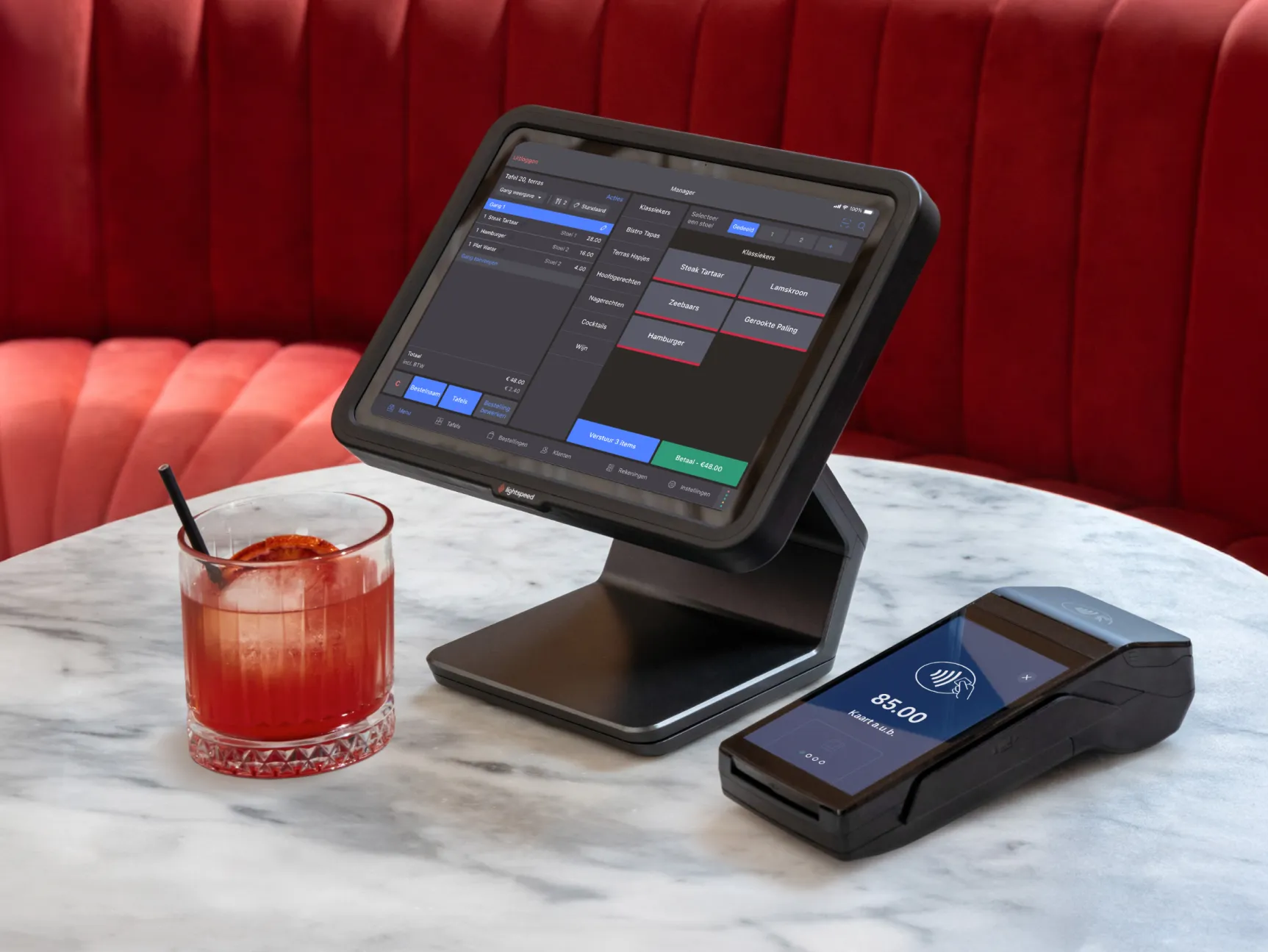 Lightspeed POS with a cocktail next to it.