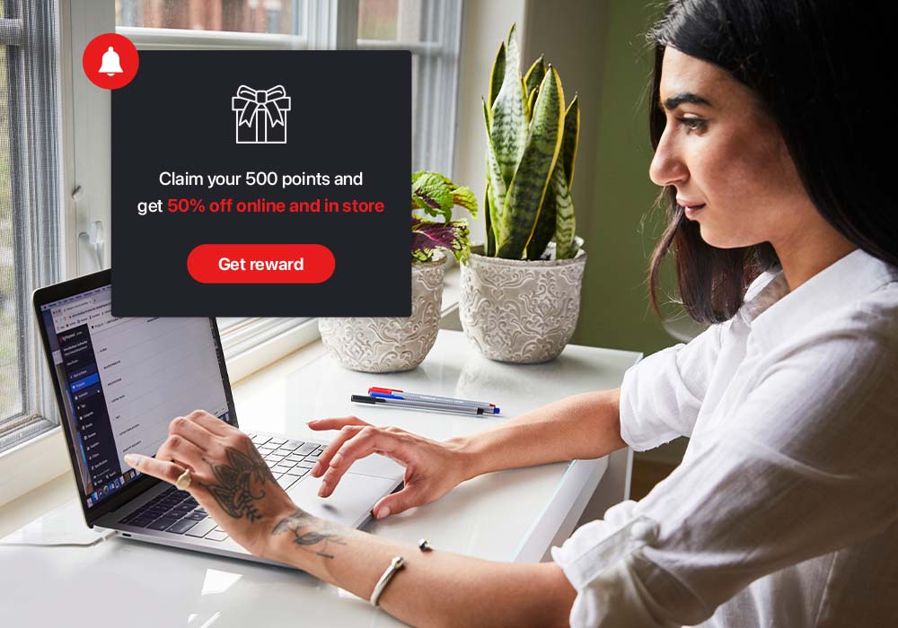 Retailer managing their loyalty programme on their laptop