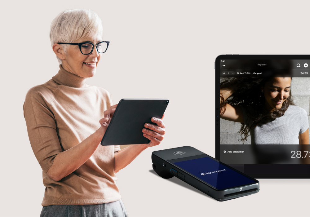 Retailer in glasses with iPad POS and Payments