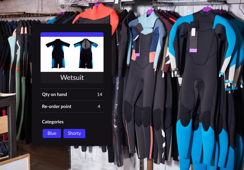 Scuba wetsuits in a store on the racks with a floating module showing inventory.